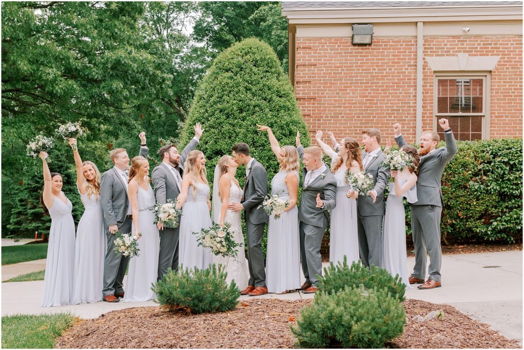 wedding party in grey hues outside of the Stonewall Golf Club 