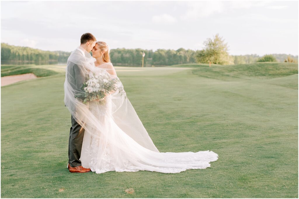bride and groom posed for photos on Stonewall Golf Club greens