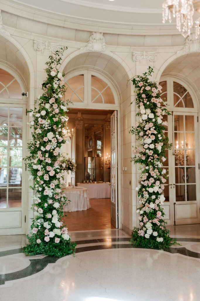 Floral arch adorning entrance to Meridian House wedding reception
